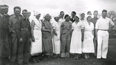 Wapnö gård. Gruppbild av deltagarna i DM i mjölkning. Anordnad av Hallands distrikt av JUF.  Bilden var publicerad i Hallands Nyheter, 1935-05-18, 