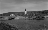 Flygfoto över Lima kyrka. Läs mer om Lima kyrka i boken: Dalarnas kyrkor i ord och bild.