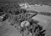 Flygfoto över Malungsfors. Malungsfors kapell år 1954.