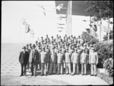 Stockholmsutställningen 1930
Gruppbild. Manlig vaktpersonal i ljusa uniformer.