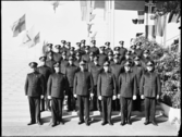 Stockholmsutställningen 1930
Gruppbild. Manlig vaktpersonal i mörka uniformer.