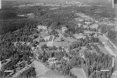 Flygfoto över Rättvik, Sjurberg med Siljansborg.