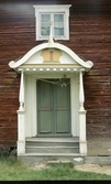 Detaljbild på dörr på gården Pallars.