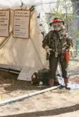 Reklamdocka klädd i kamouflagekläder på Vildmarksmässan i Ånnaboda, maj 1991