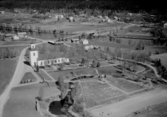 Flygfoto över Transtrands kyrka 1962.