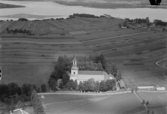 Flygfoto över Åhls kyrka, Insjön 1933.