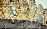 Del av väggmålning. En man, herde, med en get framför bleknande löv.