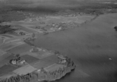 Flygfoto över Östansjö, Falu kommun, år 1950.