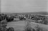 Hamra. Utsikt från kyrktornet. Hamra ligger geografiskt inom landskapet Dalarna och är en del av Orsa finnmark men tillhör Gävleborgs län.