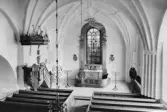 Interiör av Torsångs kyrka. Läs mer om Torsångs kyrka i boken: Dalarnas kyrkor i ord och bild.