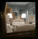 1950. Paris. Ett sovrum fotat genom ett skyltfönster