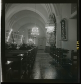 1950. Leksands kyrka. Folk sittandes i kyrkbänkar