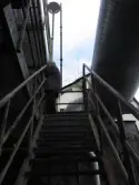 Trappa i byggnad vid Soabs industrianläggning i Mölndals Kvarnby, år 2007. En man är på väg upp. Anläggningen användes vid fototillfället av Hexion Speciality Chemicals Sweden AB.