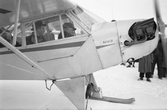 Flyguppstigning på skarsnö med medar, 1950-03-11