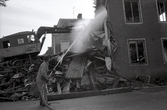 Rivningen hörnhuset Västerlånggatan - Gamla Kungsgatan 21 september 1970.