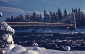 Arbetsbilder från vattenrallare Egon Frisk, en hängbro troligtvis i Norrland i snölandskap.