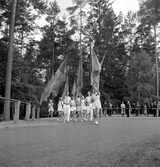 Intåg av gymnaster med fanborg på Värendsvallen under Gymnastikens dag.