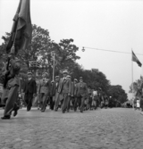 Hantverkets dag. Ett demonstrationståg är på väg längs Kronobergsgatan söderut, i höjd med Sandgärdsgatan. Grodperspektiv.