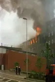 Branden i byggnaden Stora Götafors i Mölndals Kvarnby, år 1986. Vy från Kråkan.