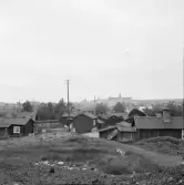 Falun, från varp söder om urlakningen, små gyttrade gårdar vid Gamla herrgården. I bakgrunden Västra skolan.