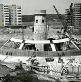 Järnbrott
Marconigatan
Panncentralen Tratten stod klar år 1963. Trattens funktion var att förse Göteborgs stads bostadsaktiebolag och Fastighets AB Göteborgsbostäders nyuppförda bebyggelse i Frölunda med värme och varmt tappvatten.