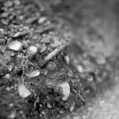 Romfartuna sn Äs RAÄ 119 Arkeologisk undersökning utförd av Vlm / Åke Hyenstrand och Ann Nilsson 1967
A3 Stenkista, raserad, belägen vid grustagskant NNÖ respektive Ö om gravfältet.