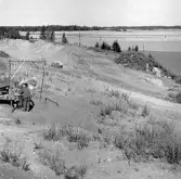 Romfartuna sn Äs RAÄ 119 Arkeologisk undersökning utförd av Vlm / Åke Hyenstrand och Ann Nilsson 1967
Grusåsen med gravfältet vid Äs.
Samhör med:  Inv.nr 18164