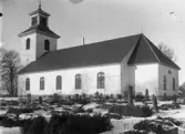 Nöbbele kyrka med kyrkogård. Vinterbild.