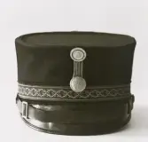 Polismössa från 1906-1926. Mössmärke med 