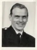 Poliskonstapel Nils Hansson, ca 1950-55. 
Bröstbild, halvprofil. Ateljéfoto.
