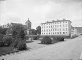 Folkskoleseminariet - Dekanhuset och Helga Trefaldighets kyrka från Riddartorget, Uppsala 1890