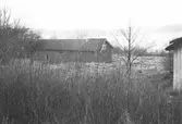 Uthus på Tållered 1:8 i Tållered, februari 1991.
Fastigheten ägdes av Werner Karlsson (död 1990).