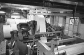 En maskin för papperstillverkning, 1980-tal.
Bilden ingår i serie från produktion och interiör på pappersindustrin Papyrus.