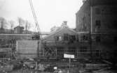 Lagerbyggnad 110 och 111 under uppbyggnad på Papyrus fabriksområde, 10/12-1945.