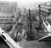 Lagerbyggnad 110 och 111 under uppbyggnad på Papyrus fabriksområde, 17/11-1945.