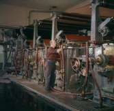 Man som arbetar vid maskin på Papyrus.
KM 2.
David ?