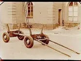 Fyrhjulig timmervagn med gummihjul.
Köpman Robert Lundahl