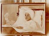 Oljemålning.
Motiv: En sjuk pojke ligger i säng.
Artisten Axel Linus.