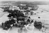 Flygfoto över Sjölunda, bostadshus och byggnader.