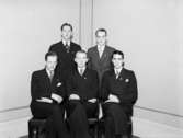 Interiör, fem unga män.
Arbetarnas Gymnastikförenings styrelse, 1936-1937.