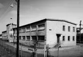 Kokkärlsfabriken, tvåvånings fabriksbyggnad.
Beställare: Sedells.