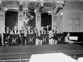 Harlems orkester, nio män med musikinstrument.