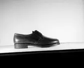 En sko.
Oscaria Skofabrik.