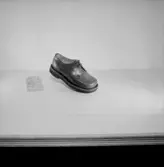 En sko.
Oscaria Skofabrik.