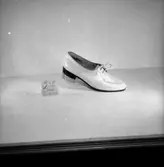 En sko.
Oscaria Skofabrik.