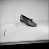 En sko.
Oscaria Skofabrik.