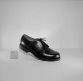 En sko.
Oscaria Skofabrik.