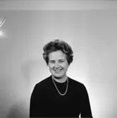 En kvinna, bröstbild.
Örebro Sparbank.