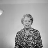 En kvinna, bröstbild.
Örebro Sparbank.