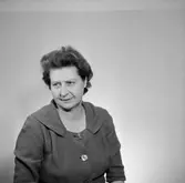 En kvinna, bröstbild.
Örebro Sparbank.